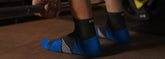 Athletic sports socks with cushioned sole and bold accent colours, styled for action
